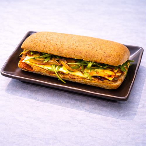 Chicken and red pesto sandwich with caramalized onion